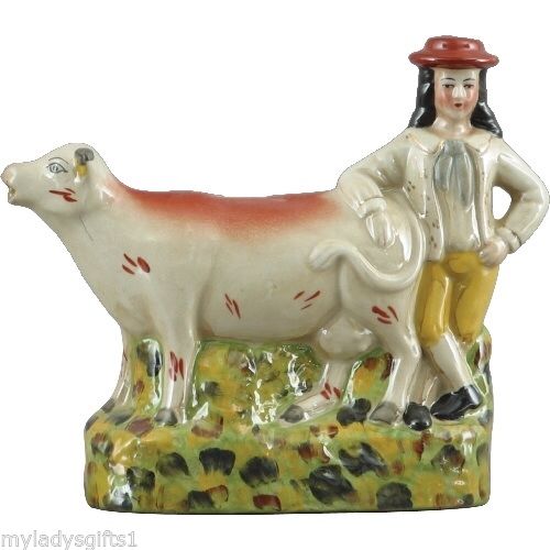 Staffordshire Boy and Cow Figurine